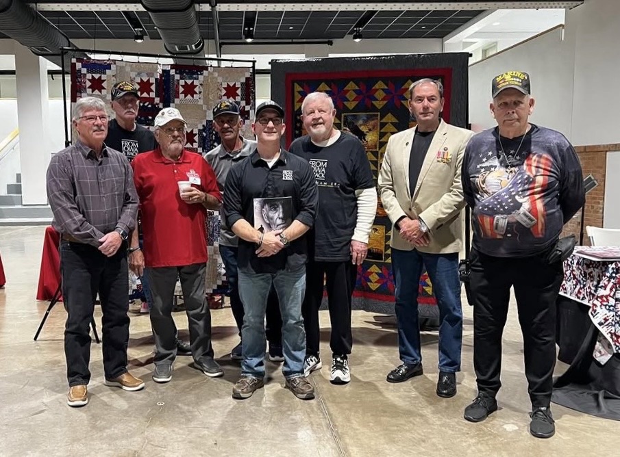 Jeremy Glazier with Bruce VanKerckhove, Chuck Williams, John Erceg, Terry Carleton, Tom Erceg, and Tom Ritchie featured in From Iowa and Back: The Vietnam Era at the Veterans Memorial Building in Cedar Rapids, Iowa.