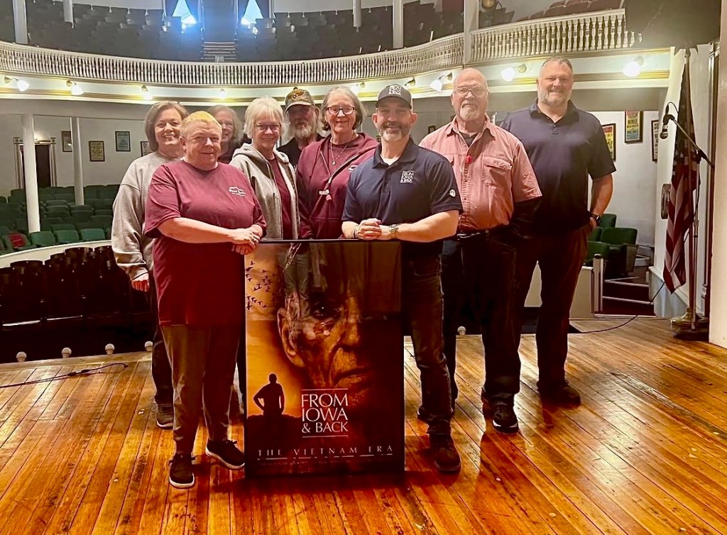 Jeremy Glazier with staff and volunteers at the What Cheer Opera House during a screening of From Iowa and Back: The Vietnam Era.