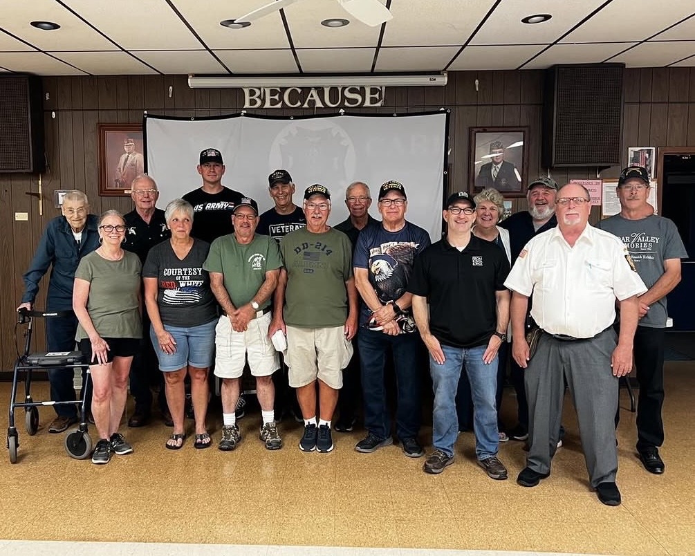 Volunteers and community members with Jeremy Glazier at the From Iowa and Back fundraiser screening at VFW Post 7920 in Osage, Iowa