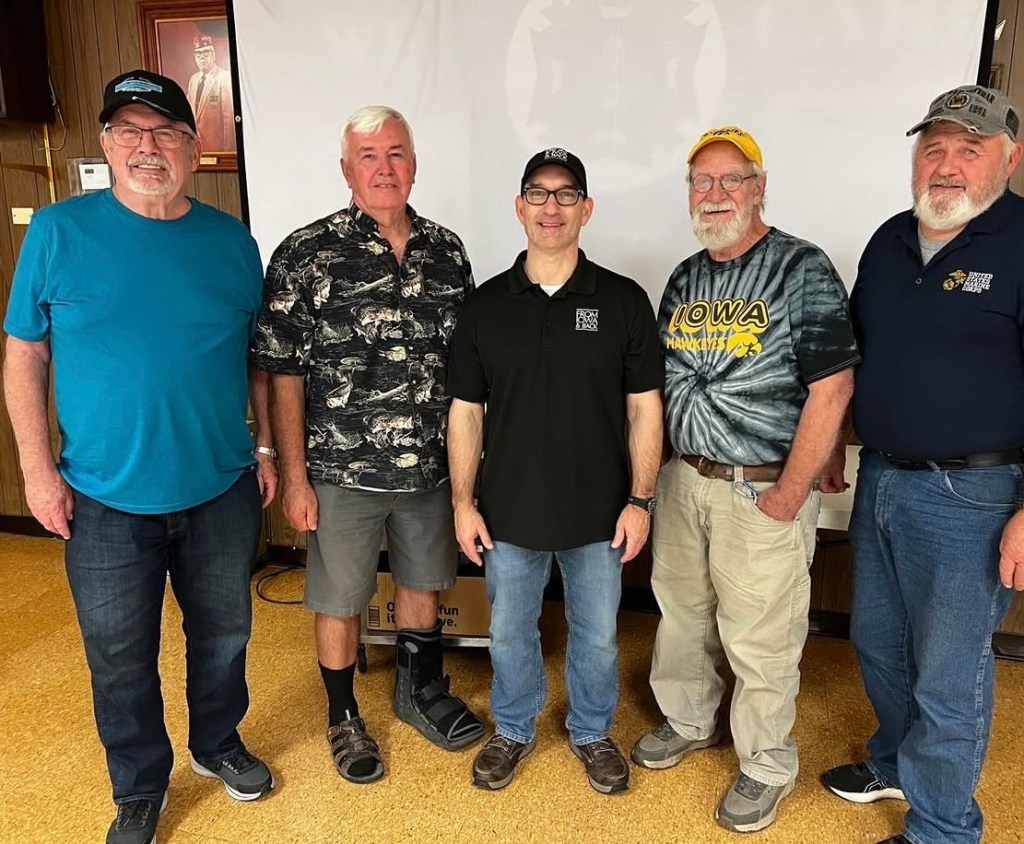 Jeremy Glazier with Vietnam-era veterans interviewed for the Continuing Stories project at VFW Post 7920 in Osage, Iowa.