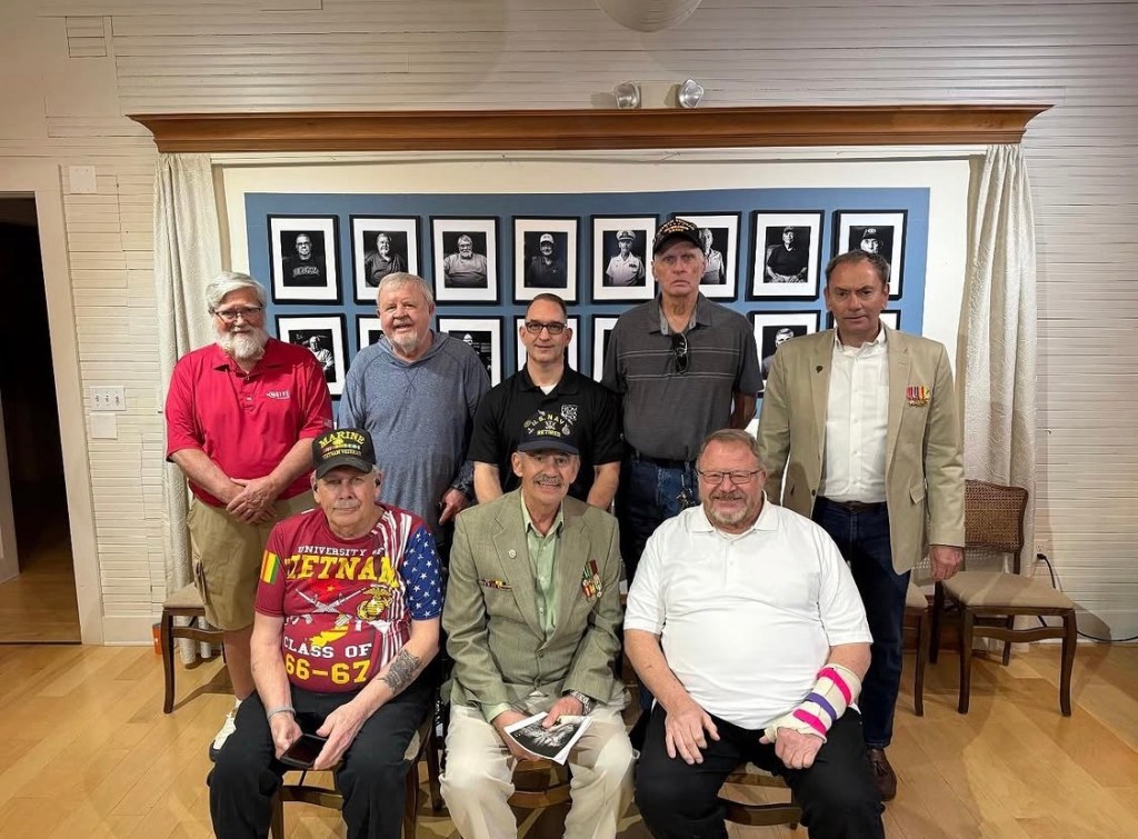 Jeremy Glazier with John Cloyd, Tom Ritchie, Terry Carleton, John Erceg, Roger Malin, Chuck Williams, and Tom Erceg at the From Iowa and Back screening at Brucemore's Carriage House in Cedar Rapids, Iowa.
